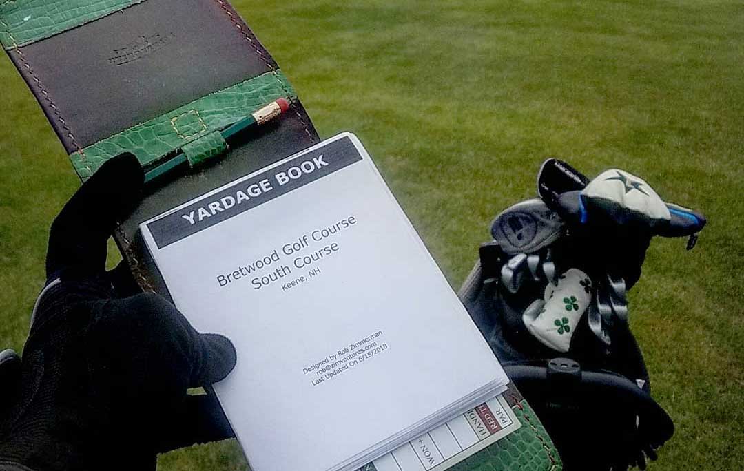 Custom yardage book on the course